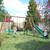 Portique en bois rond 4 agrès avec face à face et toboggan jacinthe Marron 4 - vertbaudet enfant 