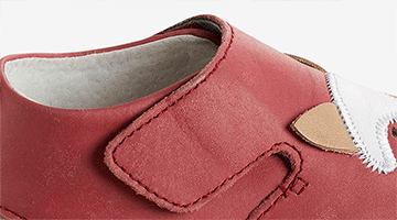 Large ouverture par patte auto-agrippante Large ouverture par patte auto-agrippante